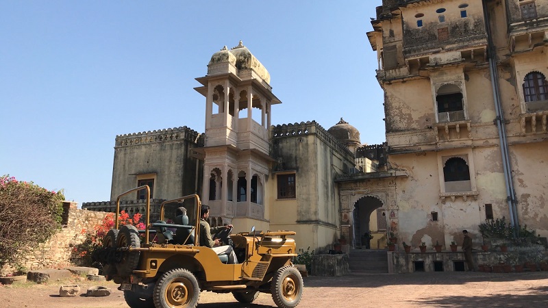Rajasthan Fort Bhainsrorgarh drone photo of allan blanchard arriving by old style open jeep