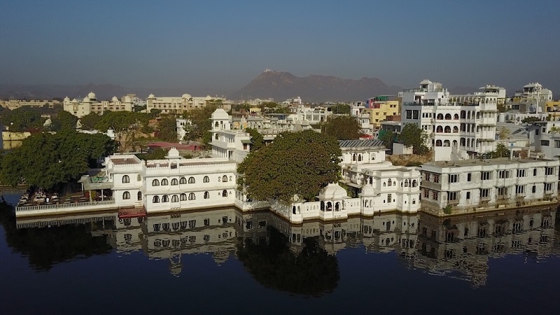 Udaipur Hotel Amet Haveli drone photo of the hotel lake pichola and monsoon palace